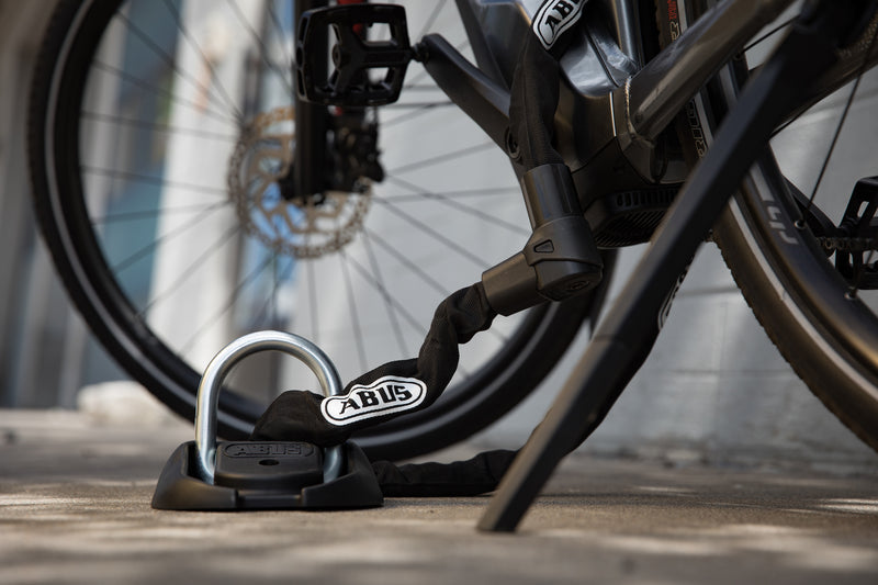 Load image into Gallery viewer, bike and anchor locking a bike
