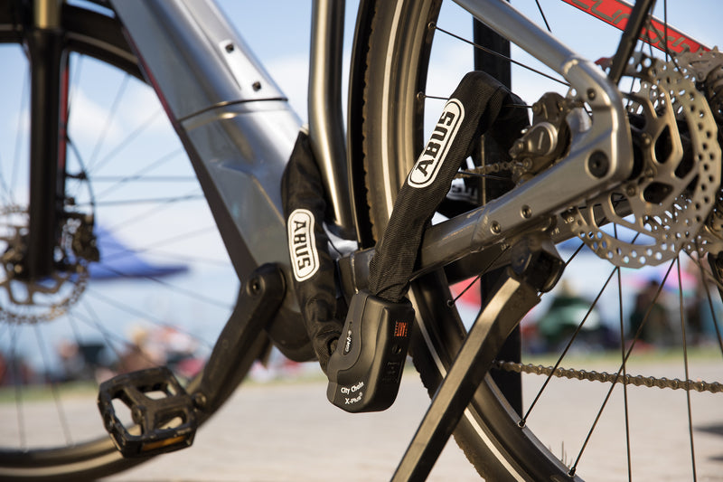 Load image into Gallery viewer, e-bike locked to bike rack with 1060 chain
