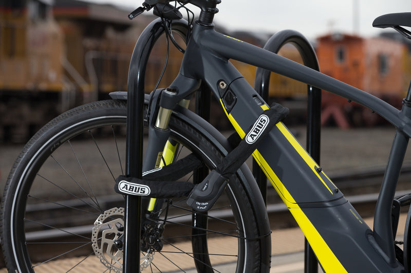 Load image into Gallery viewer, e-bike locked to bike rack with 1060 chain

