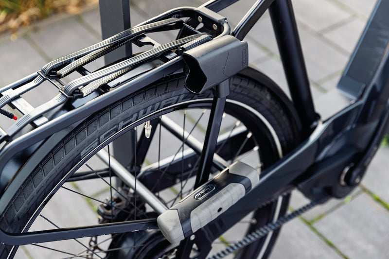 Load image into Gallery viewer, black bike secured to bike rack with ABUS GRANIT XPLus 540 long shackle u-lock #size_300mm
