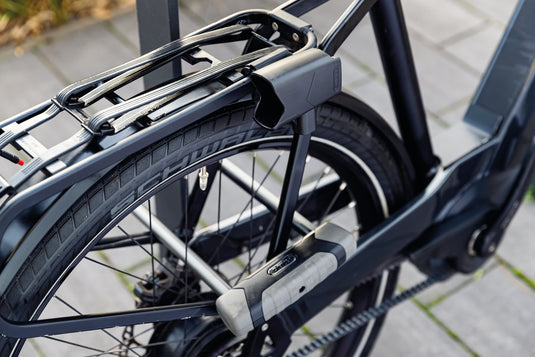 black bike secured to bike rack with ABUS GRANIT XPLus 540 long shackle u-lock