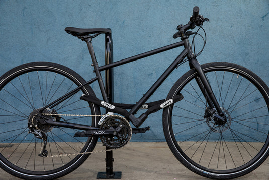 black bike locked with 1010 chain