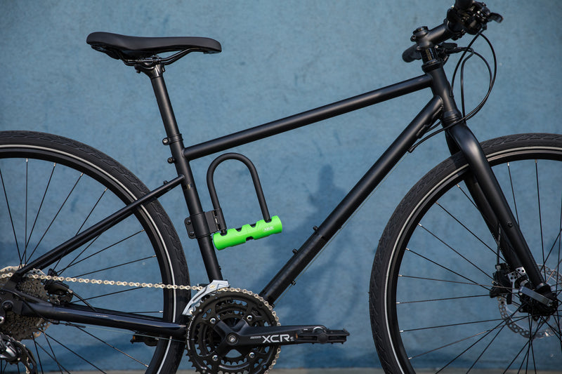Load image into Gallery viewer, Black bike with ABUS 410 Mini Long Shackle attached to bracket.  #size_180mm
