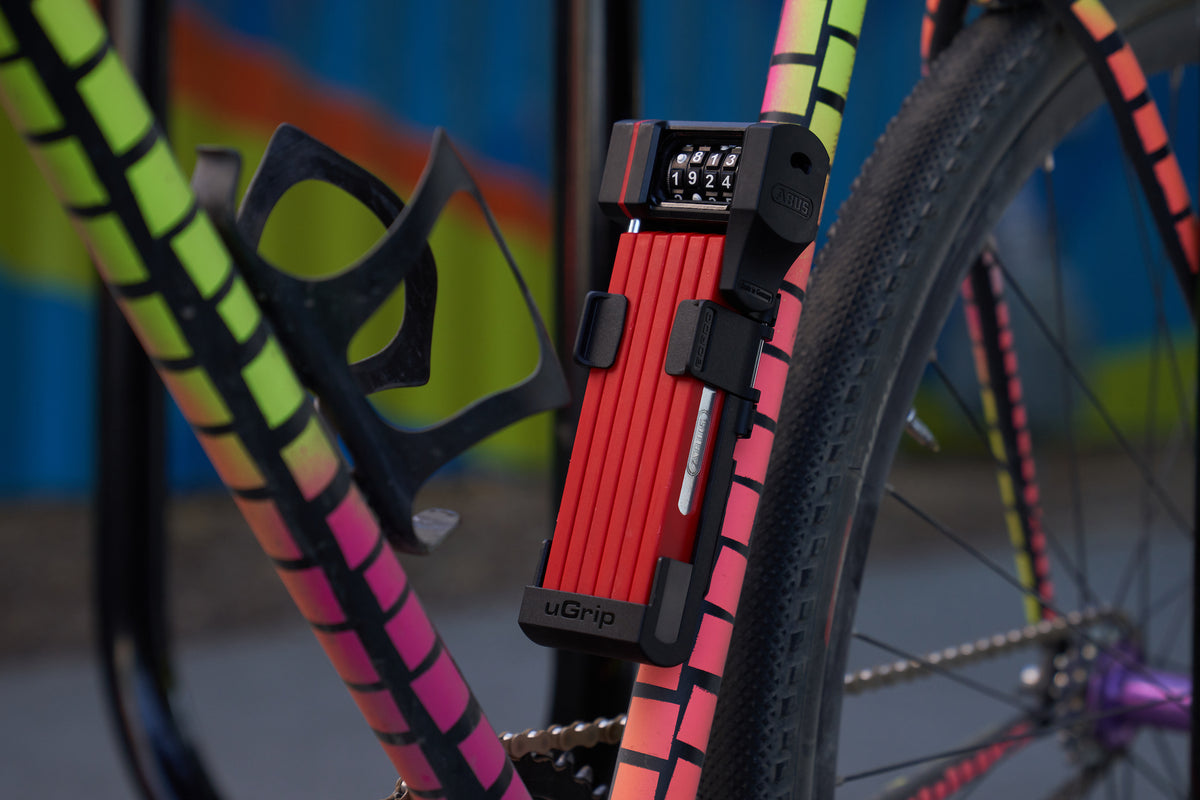 red ABUS Bordo 5700C in bracket attached to bicycle 