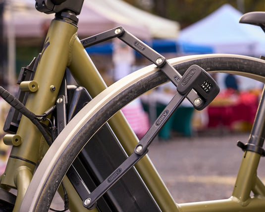 ABUS Bordo 6000C Big securing e-bike to bike rack at famers market. 