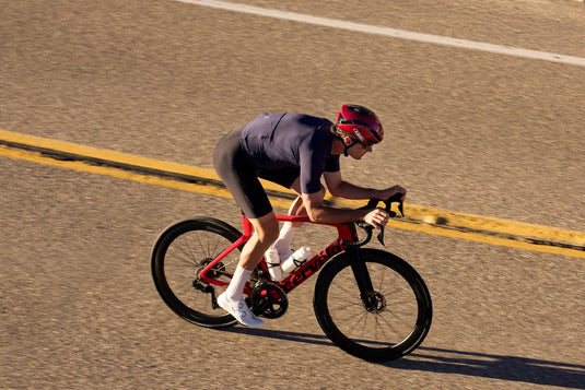 aeria shot of cyclist on road wearing red ABUS GameChanger 2.0 helmet