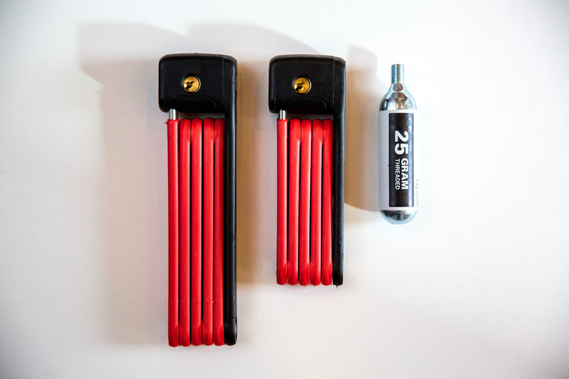 Load image into Gallery viewer, comparison shot of size of ABUS Bordo 6055, Bordo 6055 mini and 25g C02 cartridge
