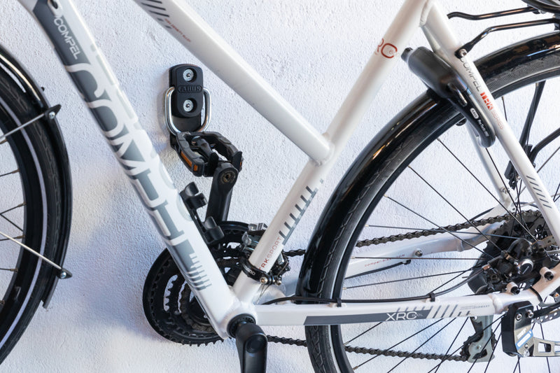 Load image into Gallery viewer, white bike hanging from wall attached to WBA65 
