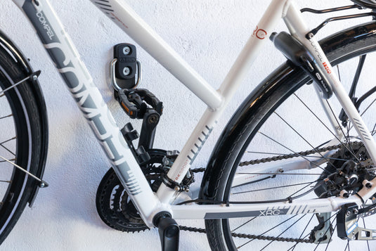 white bike hanging from wall attached to WBA65 