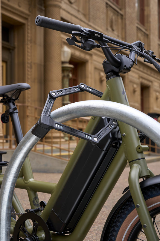 ABUS Bordo 6200K locking e-bike to rack in urban setting 