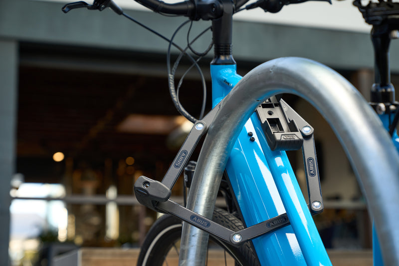 Load image into Gallery viewer, ABUS Bordo 6000K securing blue bike to rack. #size_90cm
