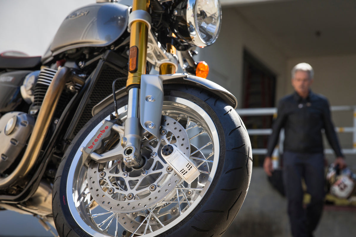 Detecto 8008 on rotor with rider walking towards motorcycle
