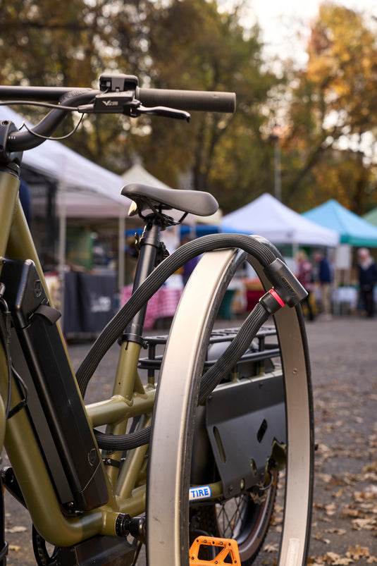 Black ABUS Goose Lock 4204K securing e-bike to rack at Farmers market. #color_black