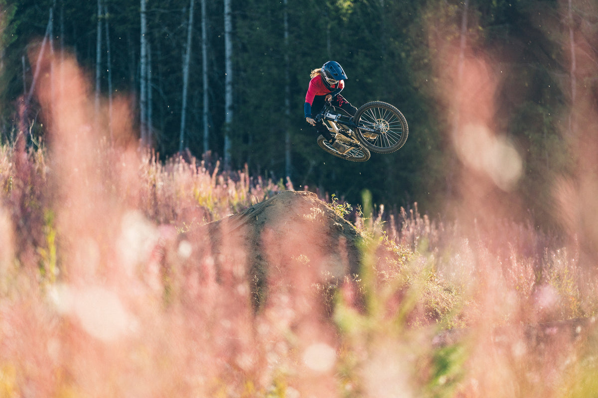 Cyclist in air wearing ABUS HiDrop helmet