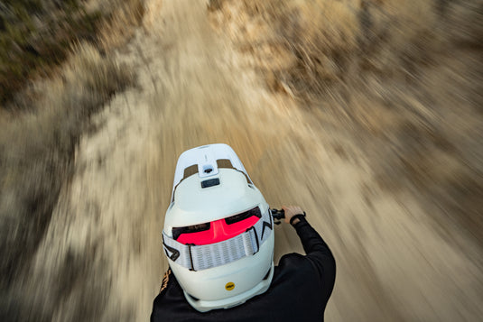 image from above of cyclist descending trail wearing with ABUS AirDrop helmet