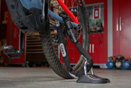 bike in garage locked with floor anchor and chain